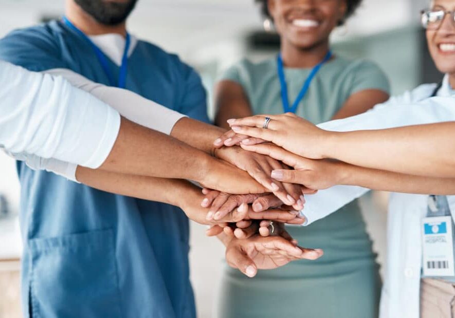 Hands together of doctors and nurses in healthcare teamwork, solidarity and support in hospital diversity. Workflow of medical people, staff or employees in hand stack sign for happy clinic workforce