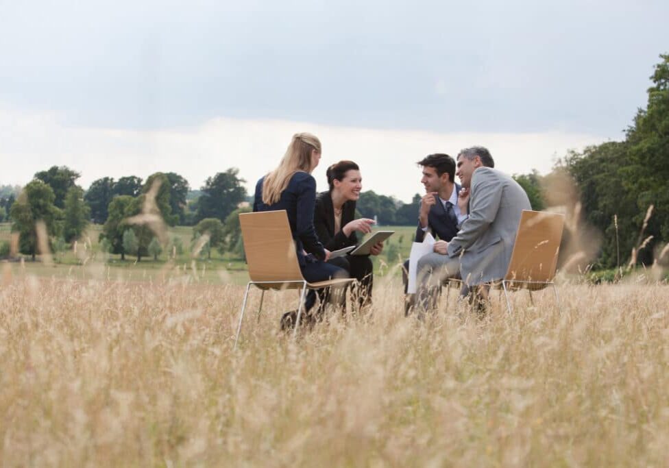 Business people having meeting outdoors